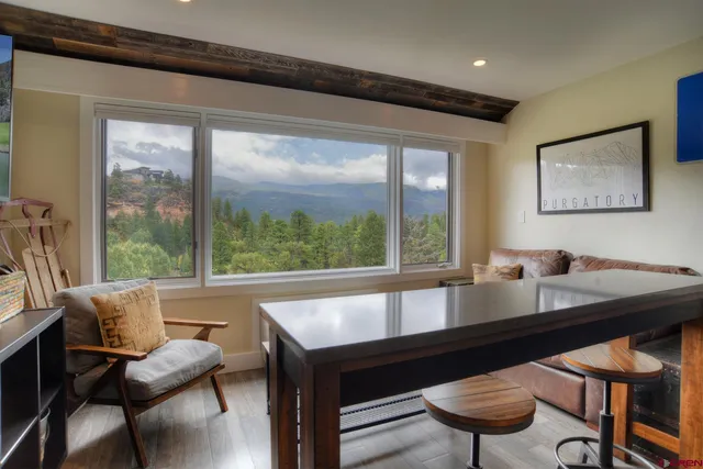 a living room with furniture and a large window