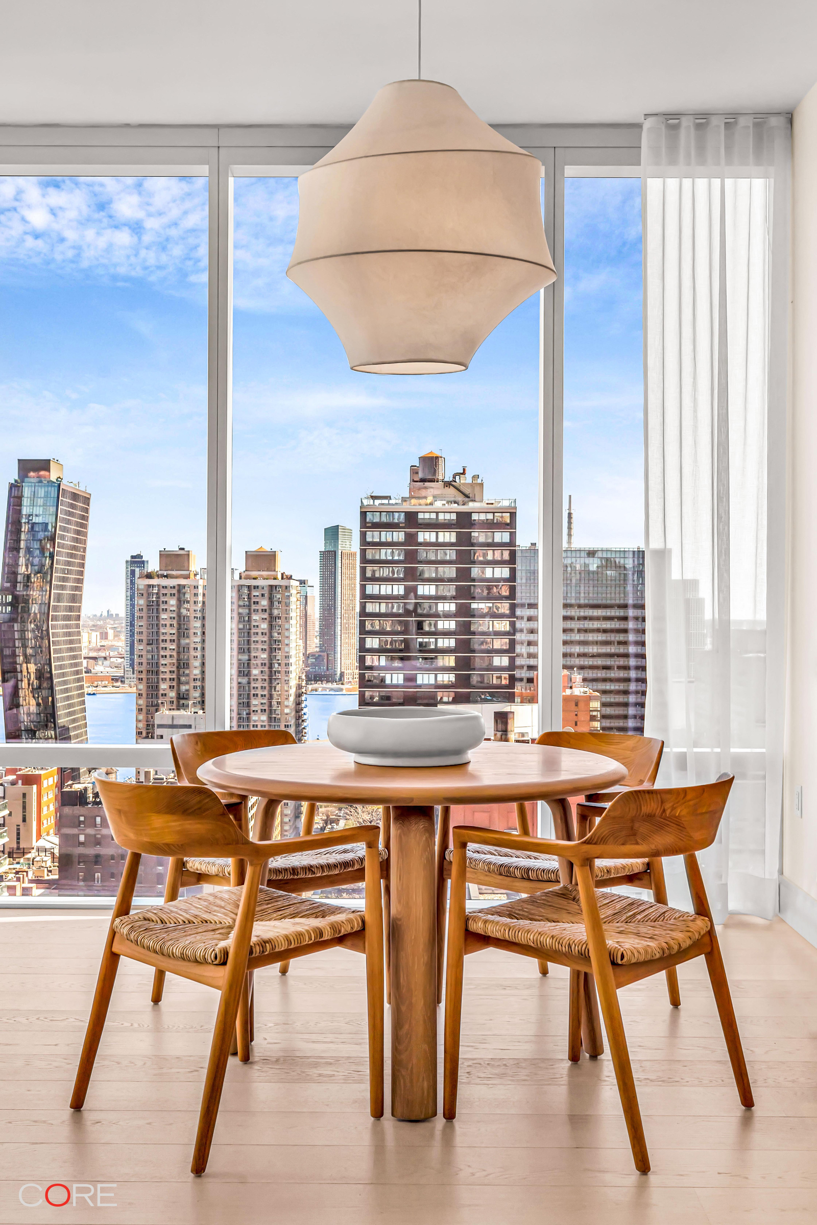 501 3rd Avenue, Unit 26B Manhattan, NY 10016 - Photo 4 of 7 a view of a dining room with furniture window and outside view