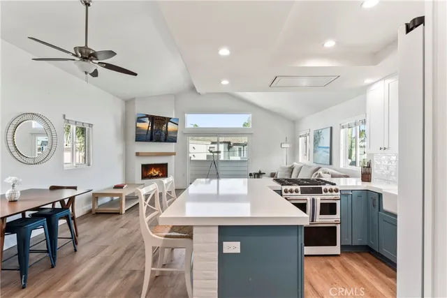 a large white kitchen with a large window