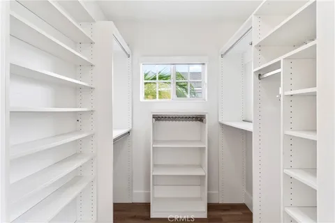 a bedroom with a bed and a night stand