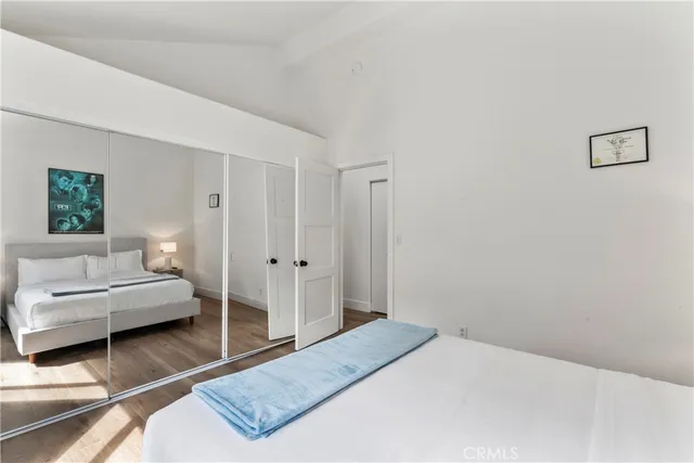 a bathroom with a toilet sink vanity and mirror
