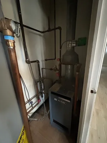 a view of storage and utility room with a washer dryer