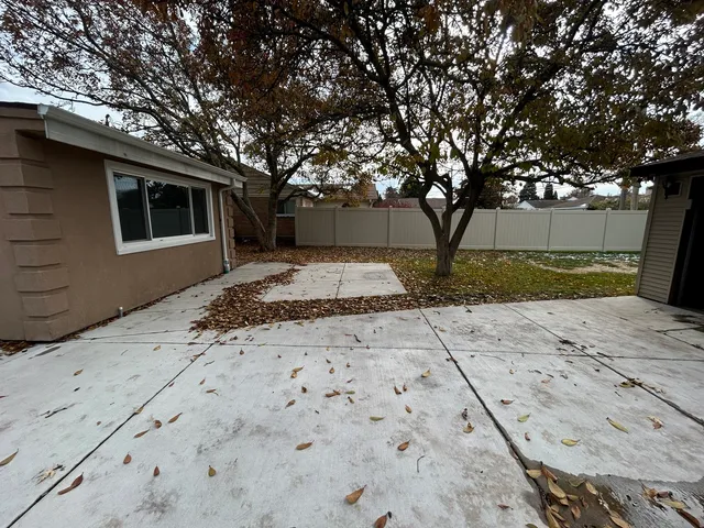a view of a backyard of the house