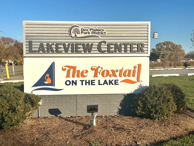 a view of outdoor space with signage and flags