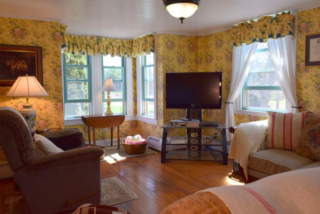 37 Nequasset Road Woolwich, ME 04579 - Photo 6 of 25 The living room, or parlor, is light...