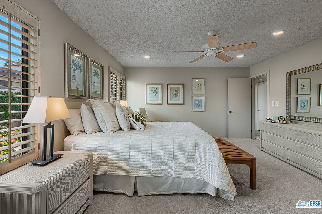 75 Durango Circle Rancho Mirage, CA 92270 - Photo 12 of 37 a bedroom with a large bed and furniture
