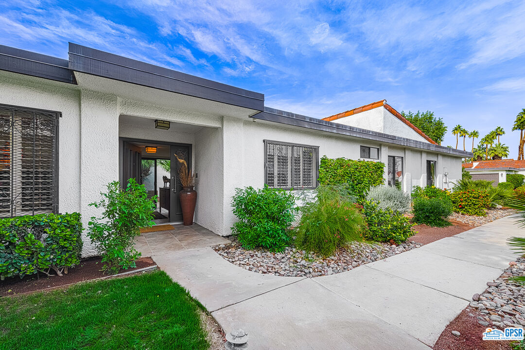 75 Durango Circle Rancho Mirage, CA 92270 - Photo 2 of 37 front view of a house with a yard