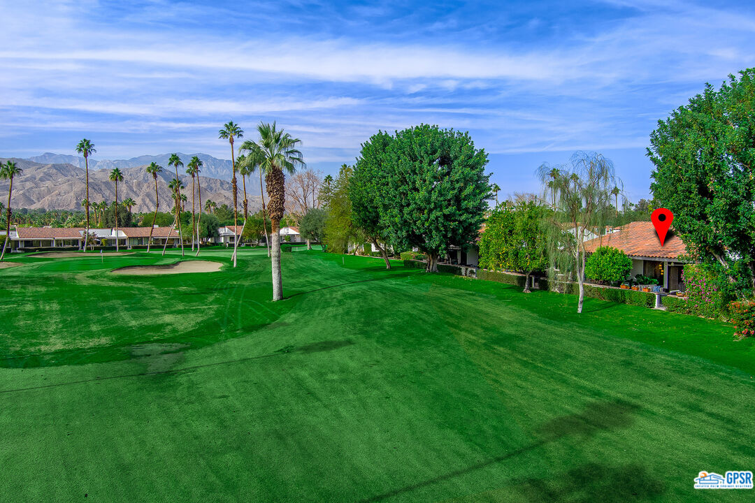 75 Durango Circle Rancho Mirage, CA 92270 - Photo 22 of 37 a view of a golf course with a lake view
