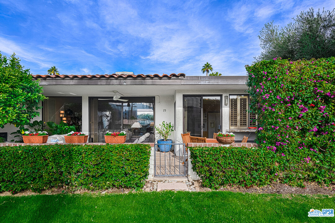 75 Durango Circle Rancho Mirage, CA 92270 - Photo 23 of 37 front view of a house with a yard