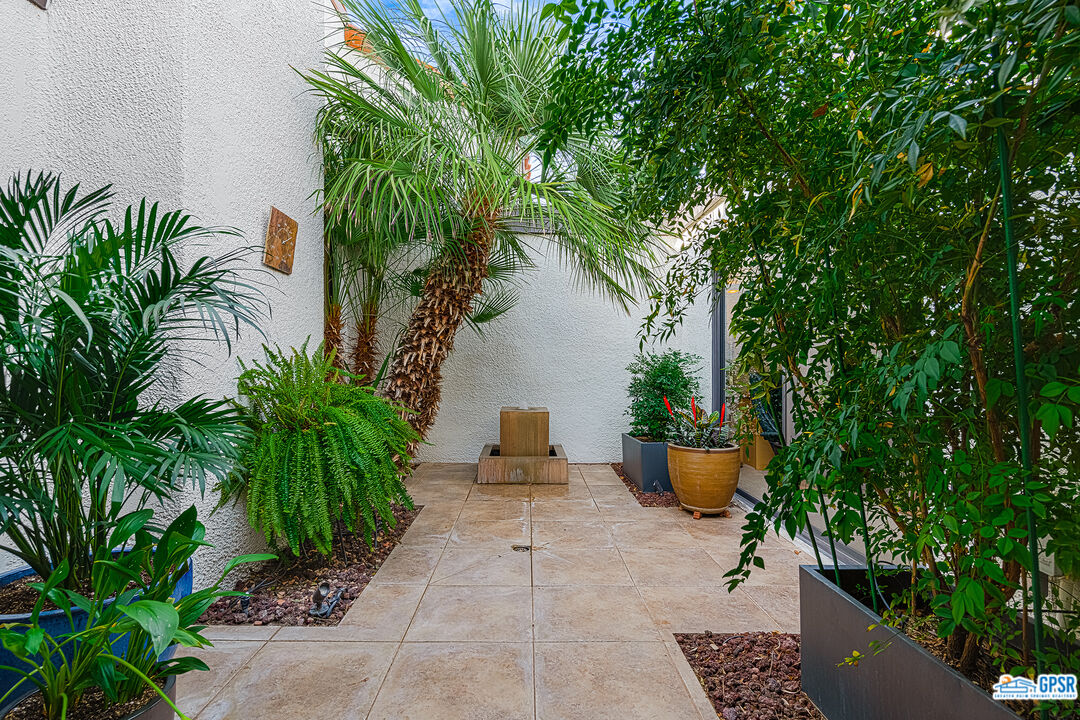 75 Durango Circle Rancho Mirage, CA 92270 - Photo 25 of 37 a view of a backyard with potted plants