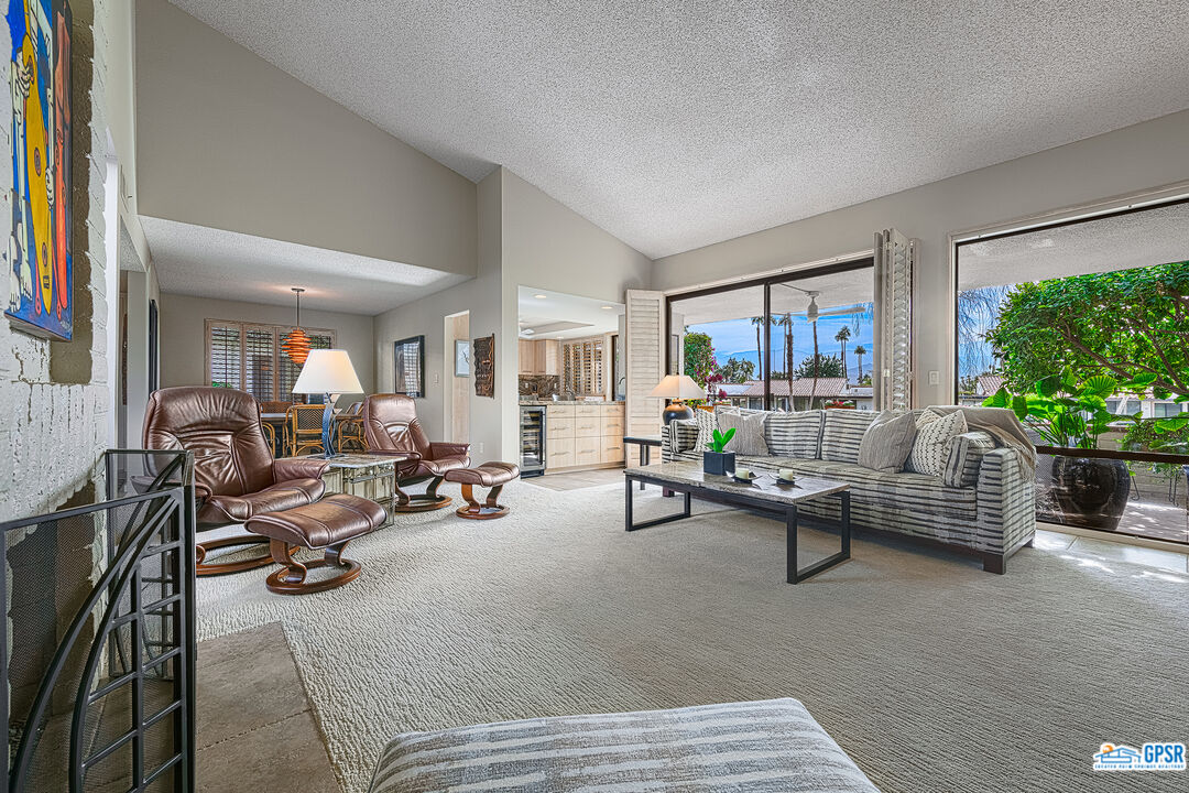 75 Durango Circle Rancho Mirage, CA 92270 - Photo 4 of 37 a living room with furniture and a potted plant