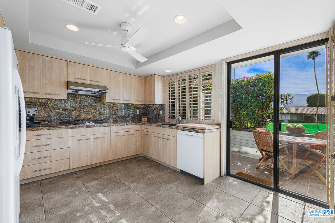 75 Durango Circle Rancho Mirage, CA 92270 - Photo 9 of 37 a kitchen with sink cabinets and outdoor view