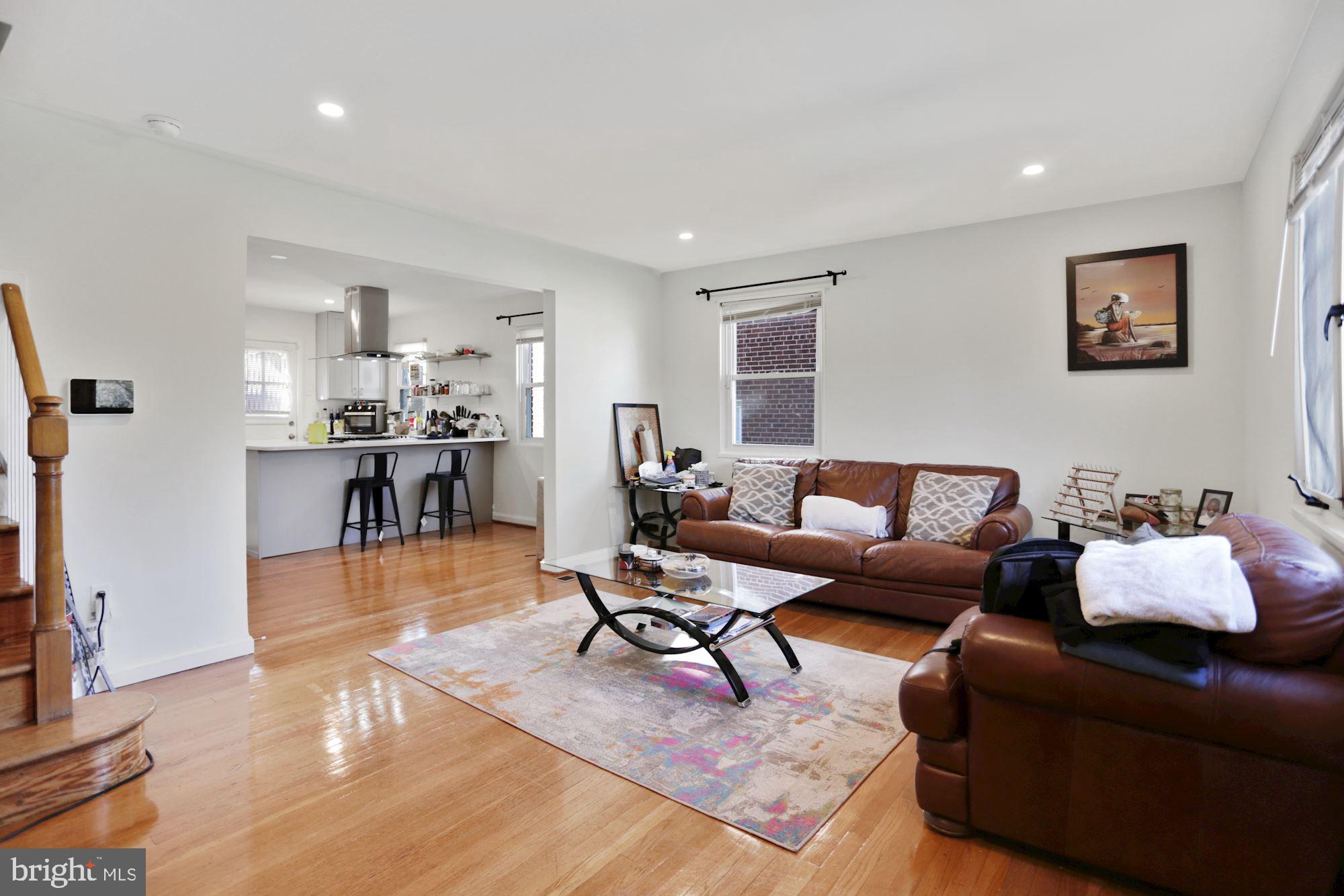 4910 Sargent Road Northeast Washington, DC 20017 - Photo 6 of 16 a living room with furniture or kitchen view and a wooden floor
