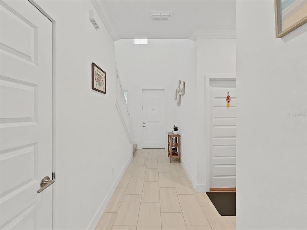 8312 Rolling Tides Drive New Port Richey, FL 34655 - Photo 17 of 49 a view of a hallway with staircase