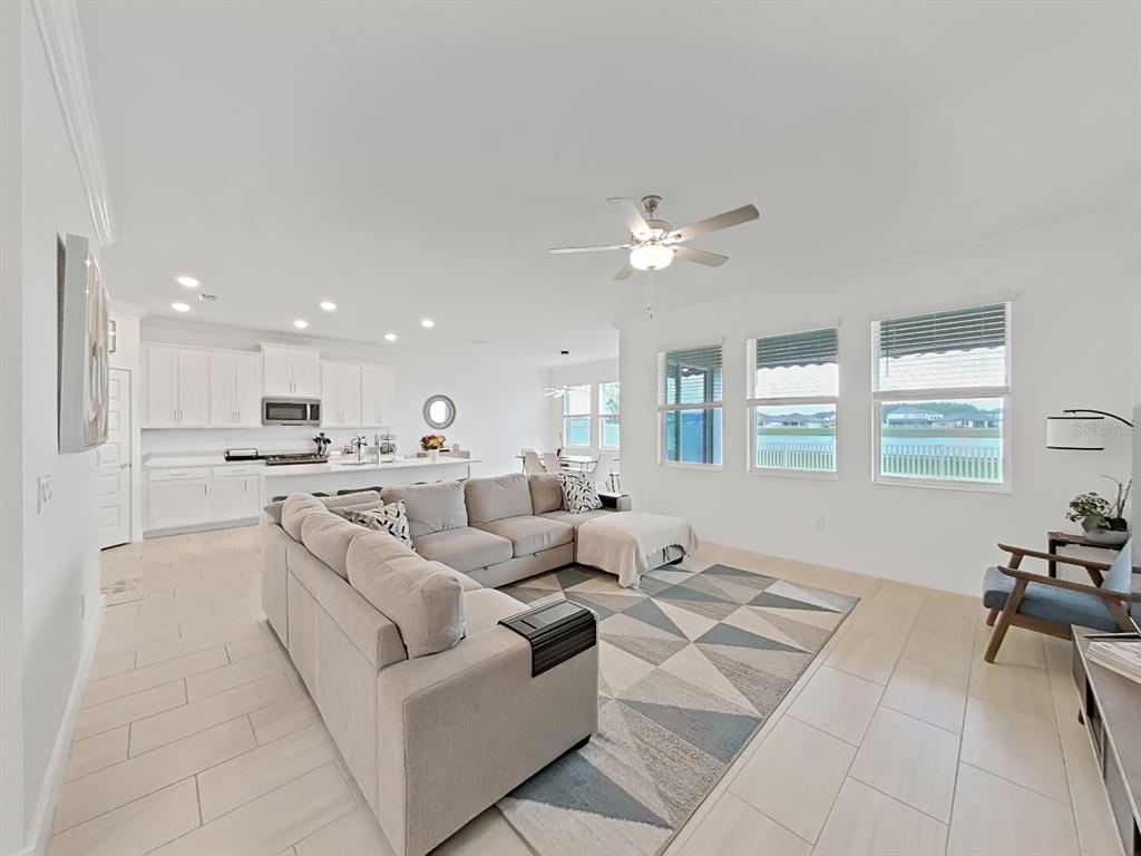 8312 Rolling Tides Drive New Port Richey, FL 34655 - Photo 18 of 49 a living room with furniture and a large window