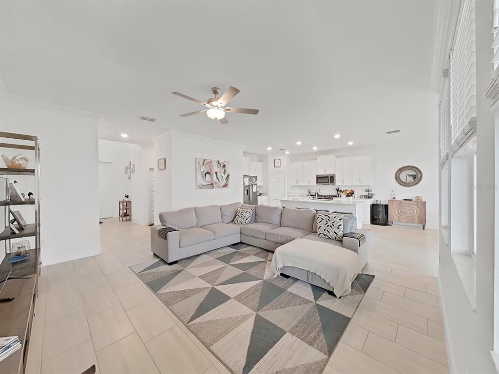 8312 Rolling Tides Drive New Port Richey, FL 34655 - Photo 19 of 49 a living room with furniture and view of kitchen