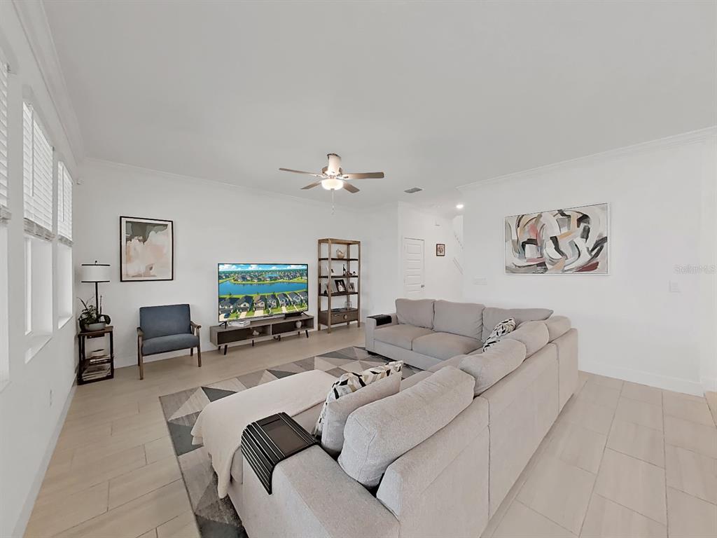 8312 Rolling Tides Drive New Port Richey, FL 34655 - Photo 20 of 49 a living room with furniture and a flat screen tv