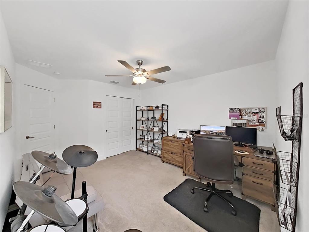 8312 Rolling Tides Drive New Port Richey, FL 34655 - Photo 41 of 49 a view of workspace with a computer on the desk and chair