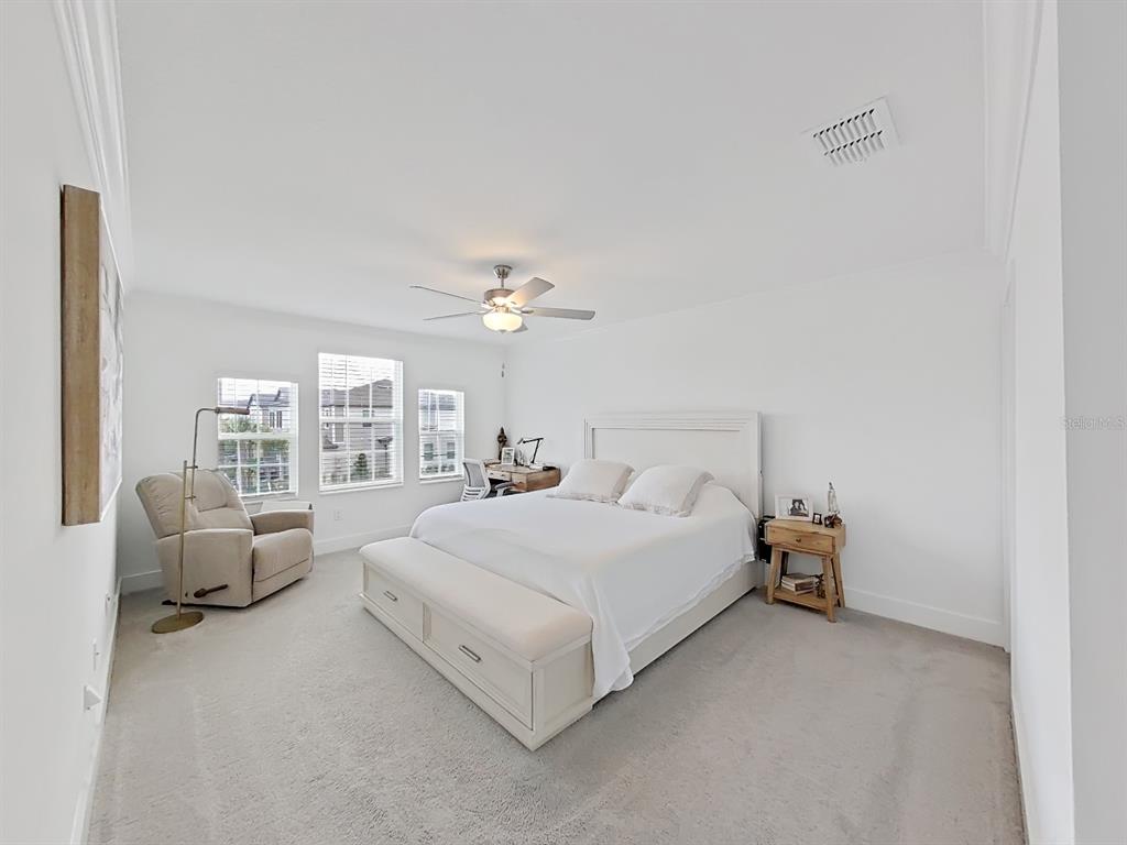 8312 Rolling Tides Drive New Port Richey, FL 34655 - Photo 42 of 49 a bedroom with bed and window