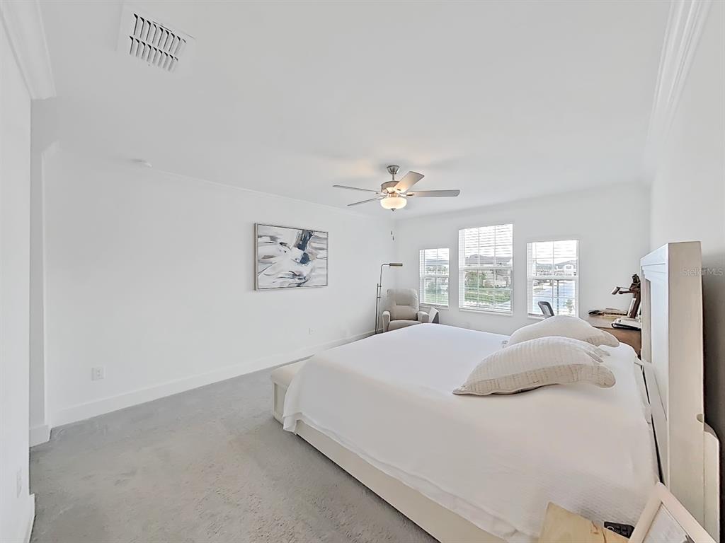 8312 Rolling Tides Drive New Port Richey, FL 34655 - Photo 44 of 49 a large bed sitting in a bedroom next to a window