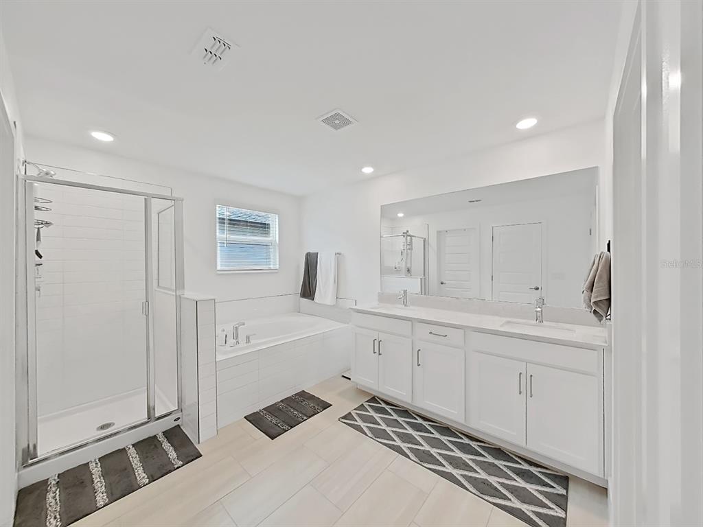 8312 Rolling Tides Drive New Port Richey, FL 34655 - Photo 47 of 49 a bathroom with a sink a toilet and shower