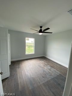 630 Royce Road LaBelle, FL 33935 - Photo 4 of 9 an empty room with wooden floor fan and windows