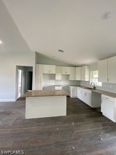 630 Royce Road LaBelle, FL 33935 - Photo 6 of 9 a large white kitchen with kitchen island and a sink