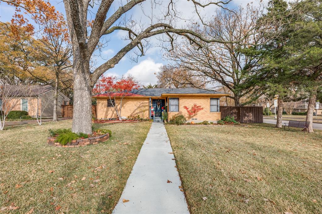 674 Harter Road Dallas, TX 75218 - Photo 1 of 1 a street view with large trees