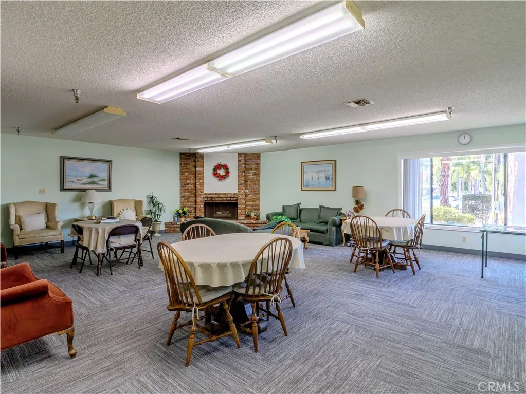 18900 Delaware Street Huntington Beach, CA 92648 - Photo 16 of 21 a view of a dining room with furniture and wooden floor