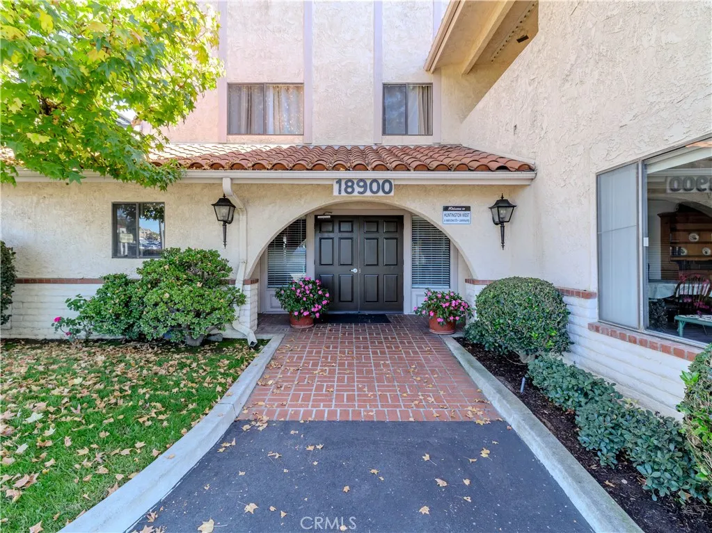 18900 Delaware Street Huntington Beach, CA 92648 - Photo 2 of 21 a front view of a house with garden