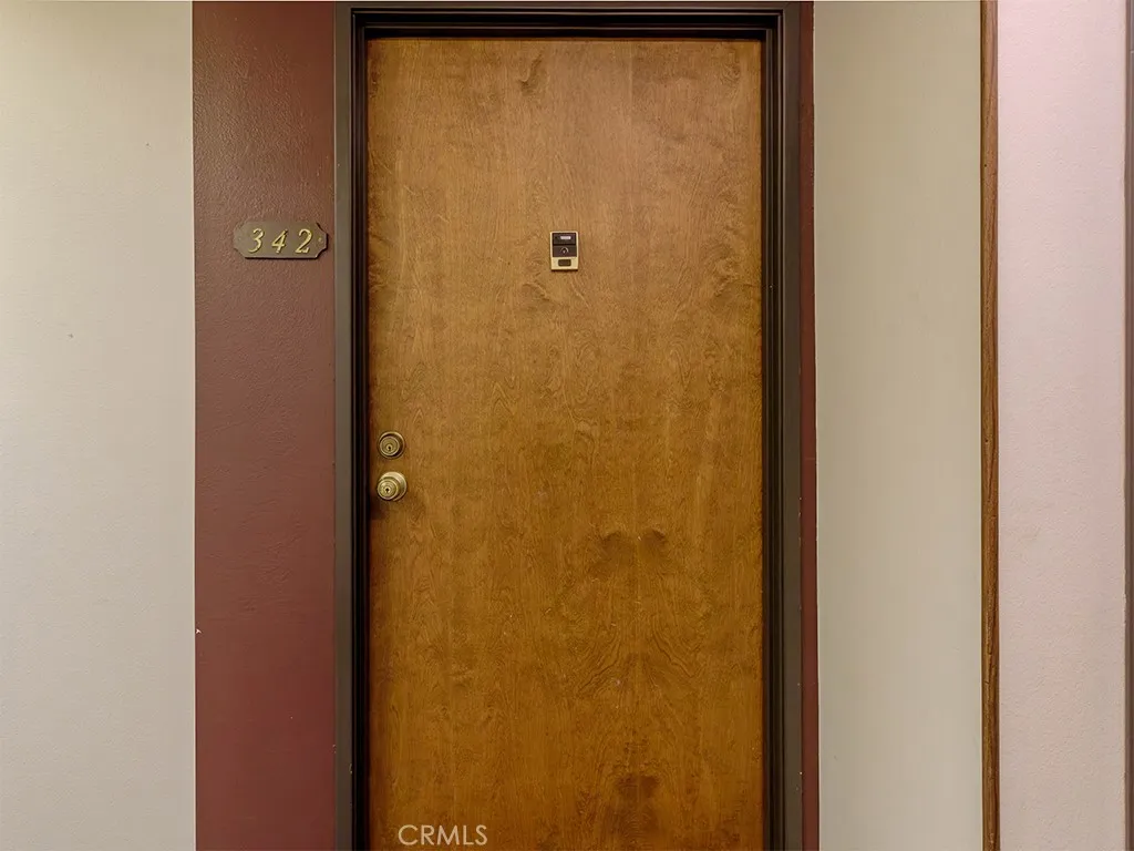 18900 Delaware Street Huntington Beach, CA 92648 - Photo 3 of 21 a bathroom with a glass door