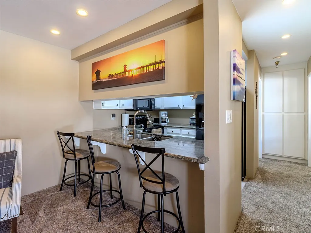 18900 Delaware Street Huntington Beach, CA 92648 - Photo 6 of 21 a view of a dining room with furniture