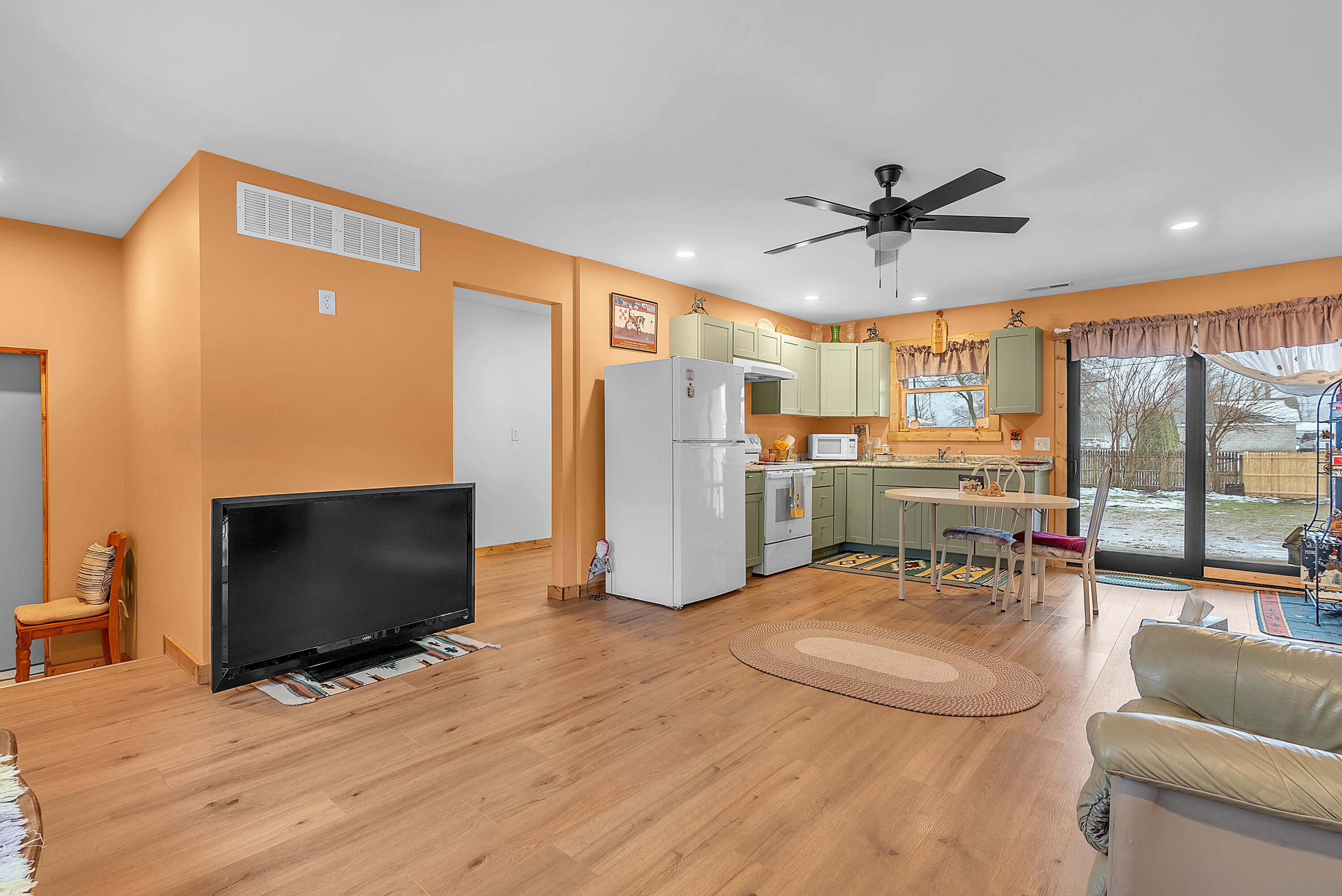 25 East Grove Street Wheatfield, IN 46392 - Photo 13 of 18 a living room with furniture and a flat screen tv