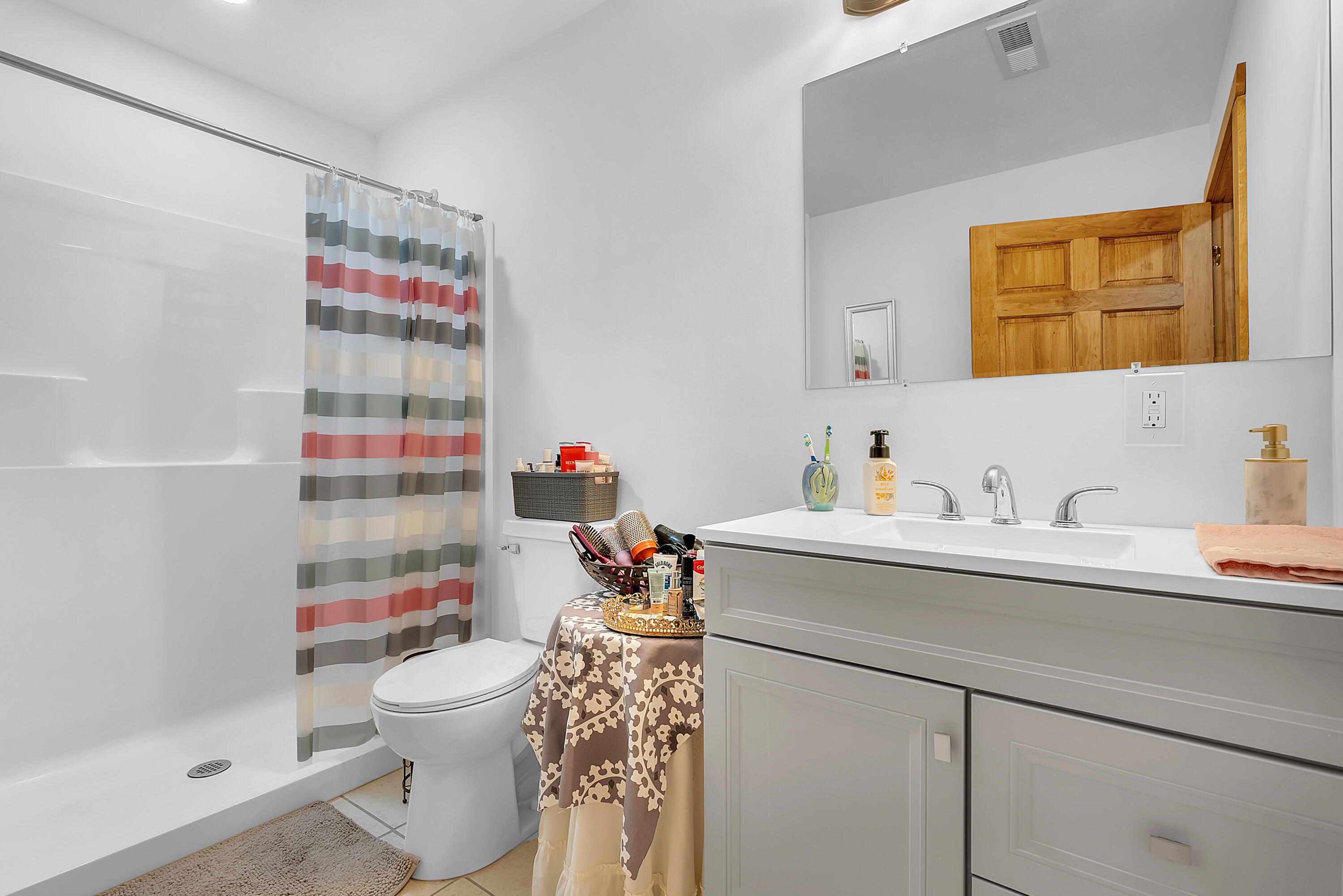 25 East Grove Street Wheatfield, IN 46392 - Photo 14 of 18 a bathroom with a sink toilet and shower