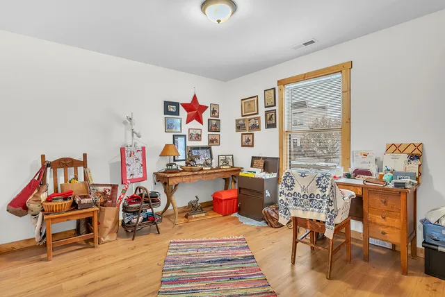 a living room with furniture a rug and a table