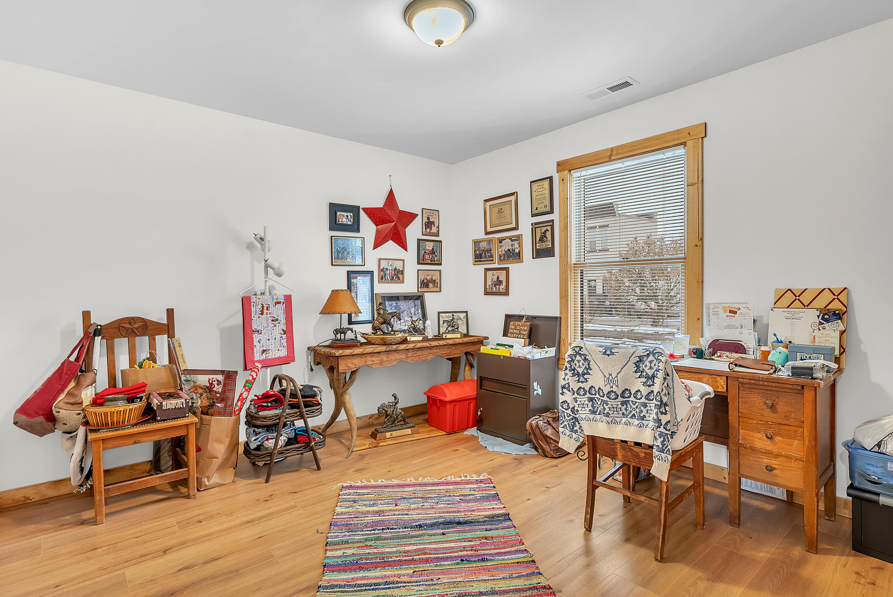 25 East Grove Street Wheatfield, IN 46392 - Photo 16 of 18 a living room with furniture a rug and a table