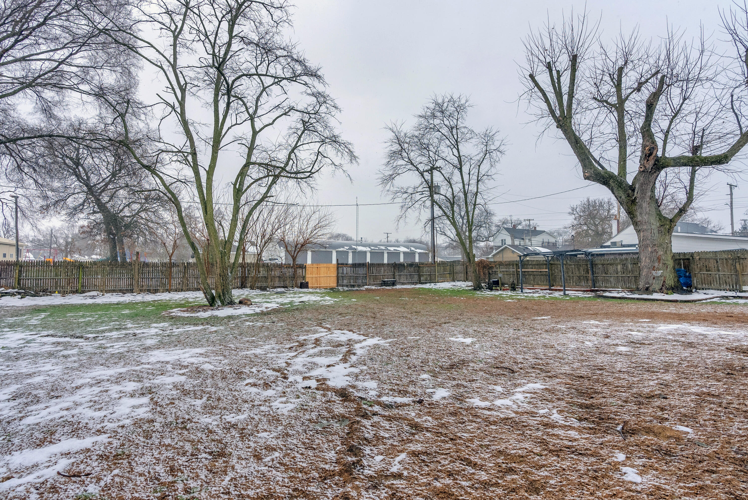 25 East Grove Street Wheatfield, IN 46392 - Photo 7 of 18 a backyard of a house with lots of green space