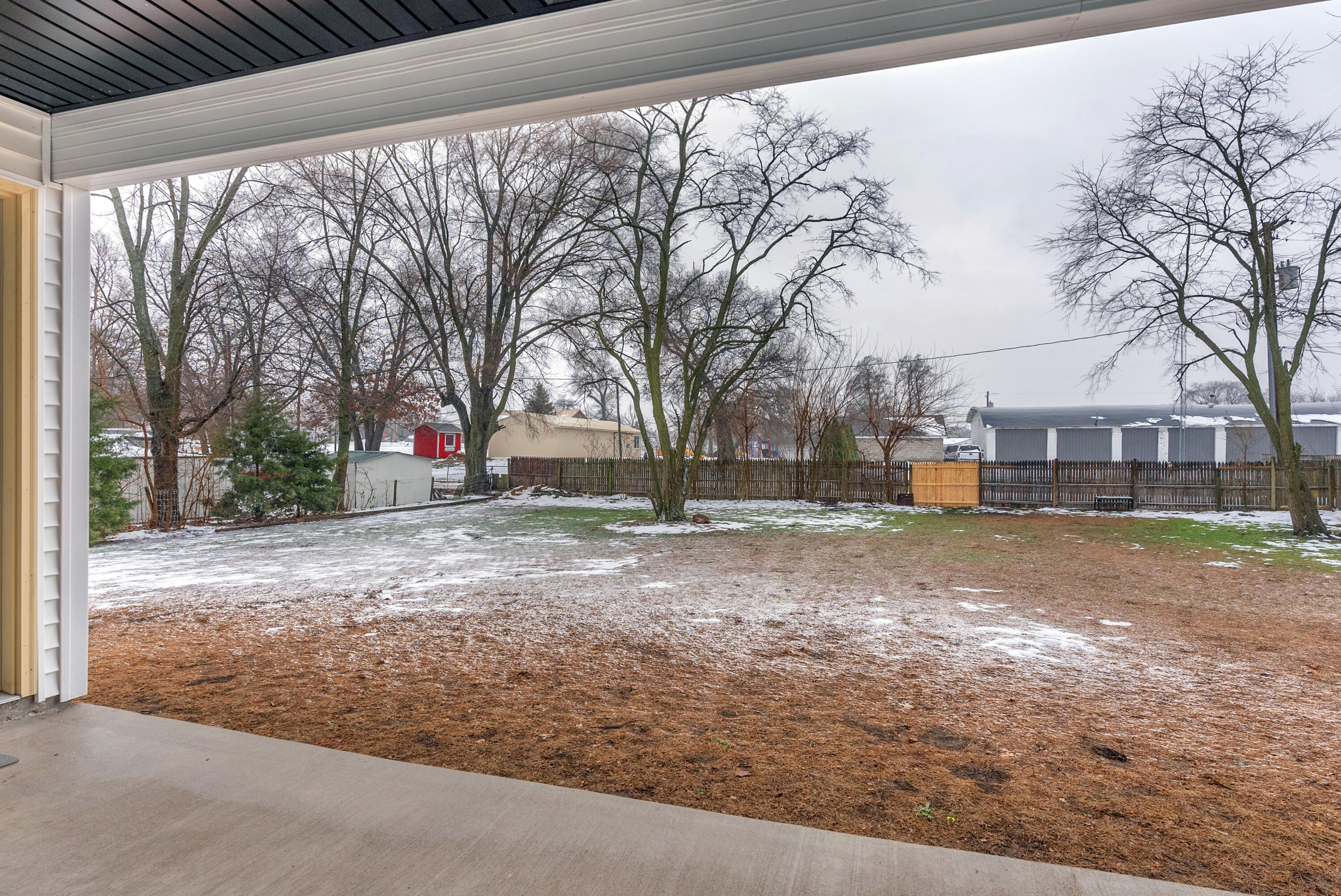 25 East Grove Street Wheatfield, IN 46392 - Photo 8 of 18 a view of road with large trees