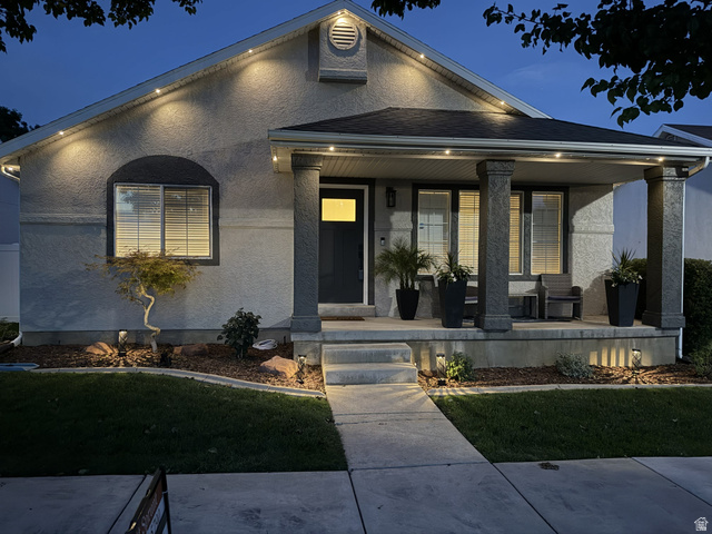 11859 Preamble Road Draper, UT 84020 - Photo 1 of 30 Stucco exterior with a covered porch featuring two columns, recessed lighting, concrete steps, and a landscaped front yard with ground lighting