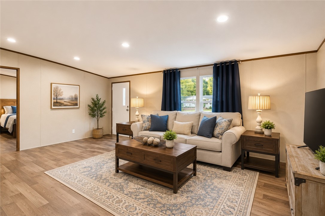 101 Drucker Ridge Anderson, SC 29625 - Photo 7 of 20 A well-lit gathering space with hard surface flooring and a classic area rug, offering comfort and style.