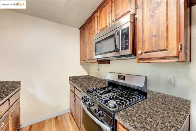 a view of a livingroom with a ceiling fan and carpet