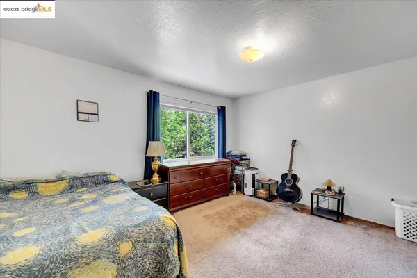 a bedroom with a bed and a table