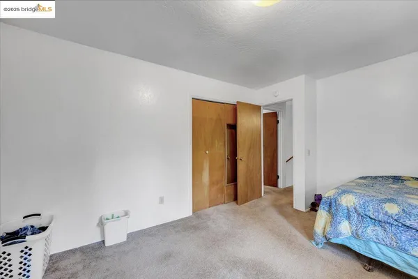 a room with a bed and a window