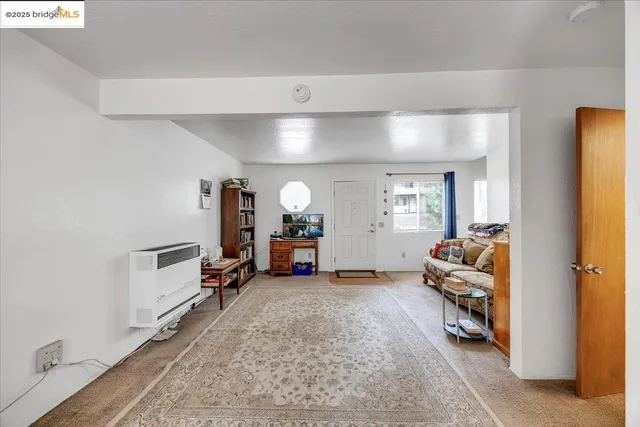 a dining room with furniture and a chandelier
