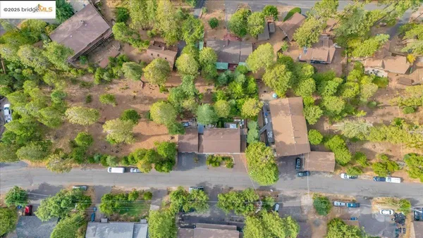 aerial view of a house with a yard and garden