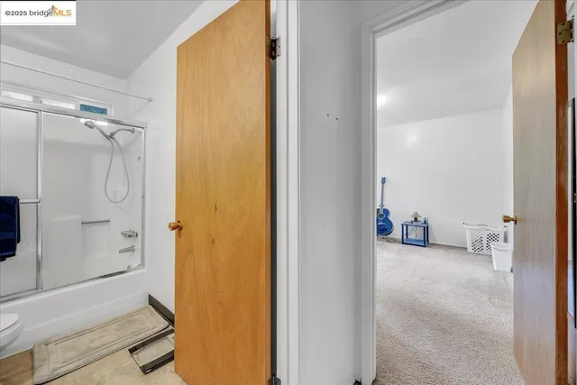 a room with a bed and a window