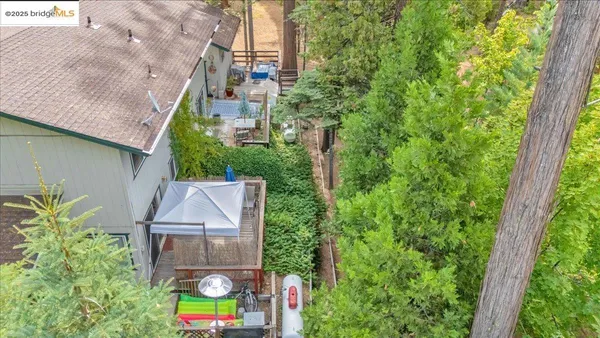 an aerial view of a house with a garden and plants