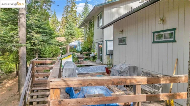 a aerial view of a house with yard and outdoor space