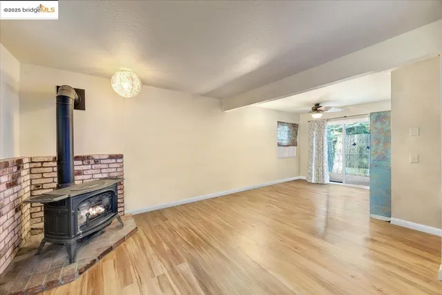 a view of room with window and ceiling fan