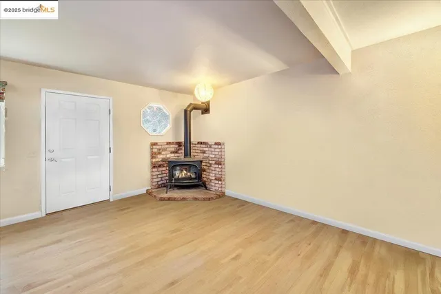 a kitchen with granite countertop a refrigerator and a sink